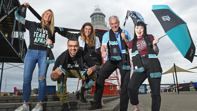 Lighthouse Wharf Hotel owner Heidi Barreau, Spot Barber Shop owner Raph Hotota, Port Adelaide Enfield Mayor Claire Boan, Port Mall Newsagency owner Philip Jenner and Black Diamond Tattoo shop assistant Clare O'Neill getting excited for Port Adelaide's finals campaign. Picture: Tom Huntley