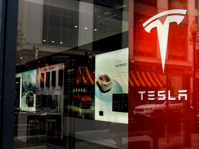 WASHINGTON, DC - JANUARY 17: A Tesla showroom is seen in the City Center shopping center on January 17, 2023 in Washington, DC. The automaker decreased the prices of their Tesla's by 20 percent, a move seen as a reaction to competition in the global market for electric vehicles and rising inflation rates.   Anna Moneymaker/Getty Images/AFP (Photo by Anna Moneymaker / GETTY IMAGES NORTH AMERICA / Getty Images via AFP)