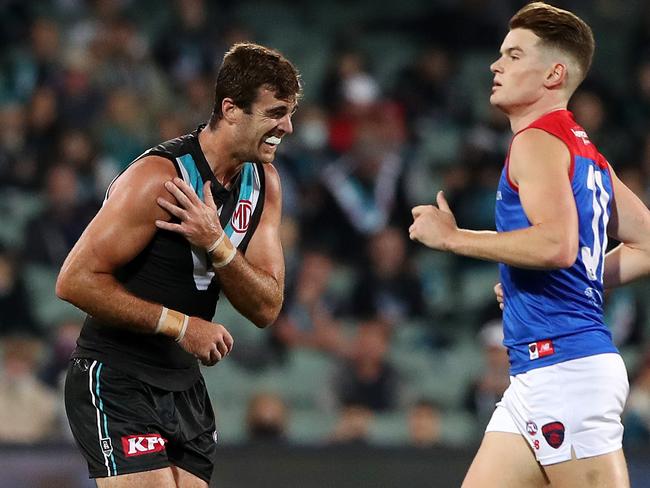 Scott Lycett dislocates his shoulder against Melbourne. Picture: Sarah Reed/AFL Photos via Getty Images