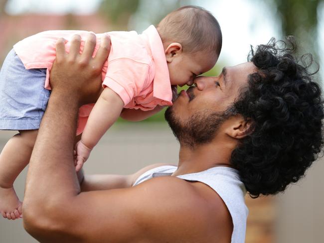 Agnatius Paasi with son Agnatius Jnr, 4 months. Pic by Luke Marsden.