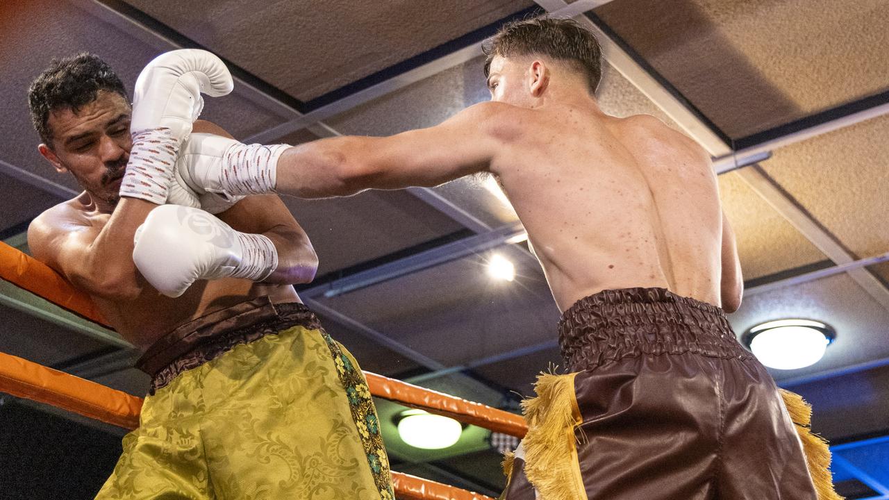 Jackson Griffiths (right) and Miguel Vazquez trade blows during the WBC Australasia Grand Champion title fight between the pair. Griffiths defended his title after fight went to the judges scorecards following an accidental head clash. Picture: Darren Burns