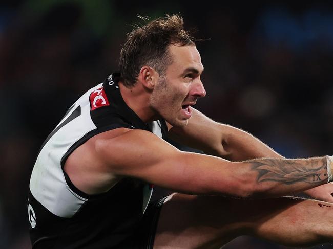 ADELAIDE, AUSTRALIA - APRIL 05: Jeremy Finlayson of the Power kicks the ball during the 2024 AFL Round 04 match between the Port Adelaide Power and the Essendon Bombers at Adelaide Oval on April 05, 2024 in Adelaide, Australia. (Photo by James Elsby/AFL Photos via Getty Images)