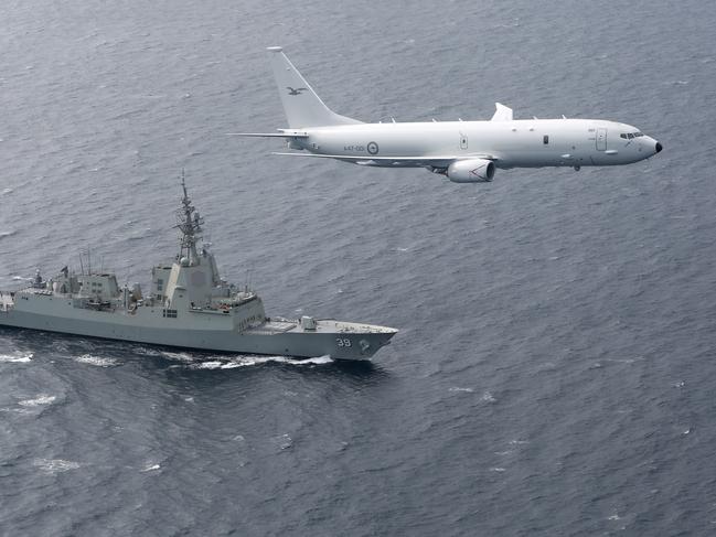 A RAAF P-8A Poseidon supports sea trials for the NUSHIP Hobart in the Gulf St Vincent off the coast of Adelaide.