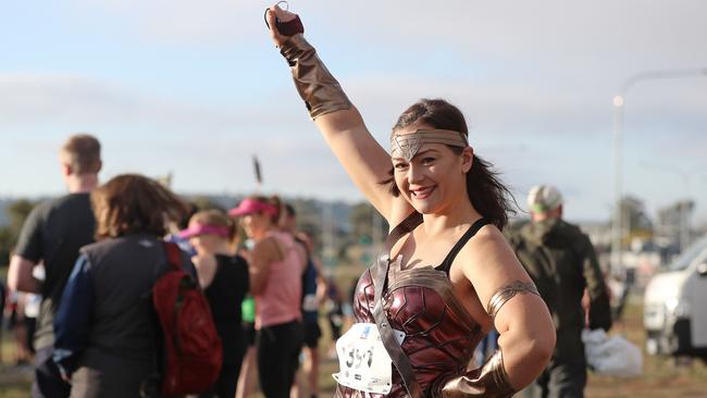 Katherine Kidd dressed as Wonder Woman running in the 2019 City to Casino. Picture: LUKE BOWDEN