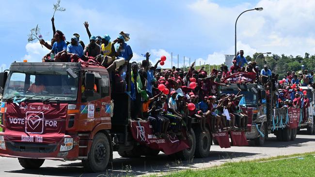 Supporters of Solomon Islands businessman and politician Namson Tran take part in an election campaign rally in Honiara on Monday. Picture: AFP