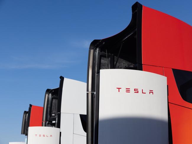 Tesla Semi electric trucks at Supercharger stations at the Frito-Lay manufacturing facility in Modesto, California, US, on Wednesday, Jan. 18, 2023. PepsiCo’s Frito-Lay is replacing its diesel-powered freight equipment with zero-emission trucks, solar panels and energy-storage systems at it's Modesto plant. Photographer: Benjamin Fanjoy/Bloomberg