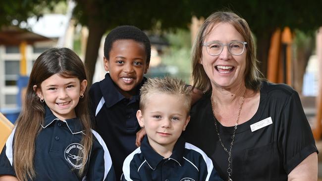 10/2/23. News Corp's Australia's Best Teachers campaign - Elizabeth Vale Primary School principal Julie Murphy.  Lily Byrt (6), Truphena Singirankabo (6), Harrison Rigney (5) and Julie at school.Picture: Keryn Stevens