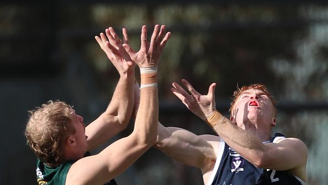 Hampden’s Paddy O’Sullivan and Ballarat’s Riley Miller go for the ball. Picture Yuri Kouzmin