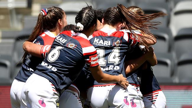 SYDNEY, AUSTRALIA - OCTOBER 10:  Zahara Temara of the Roosters   celebrates with team mates after scoring a try during the round two NRLW match between the New Zealand Warriors and the Sydney Roosters at Bankwest Stadium on October 10, 2020 in Sydney, Australia. (Photo by Mark Kolbe/Getty Images)