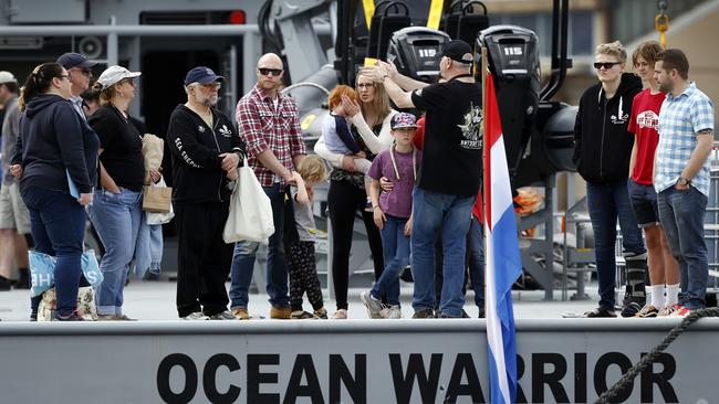 A group of visitors gets a guided tour of Sea Shepherd's new Antarctic patrol vessel Ocean Warrior, in Hobart. Pictures: KIM EISZELE