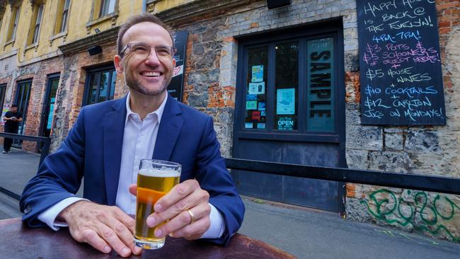 Greens leader Adam Bandt enjoys a beer outside The Evelyn Hotel in Fitzroy, which is in his electorate of Melbourne. Picture: Jay Town