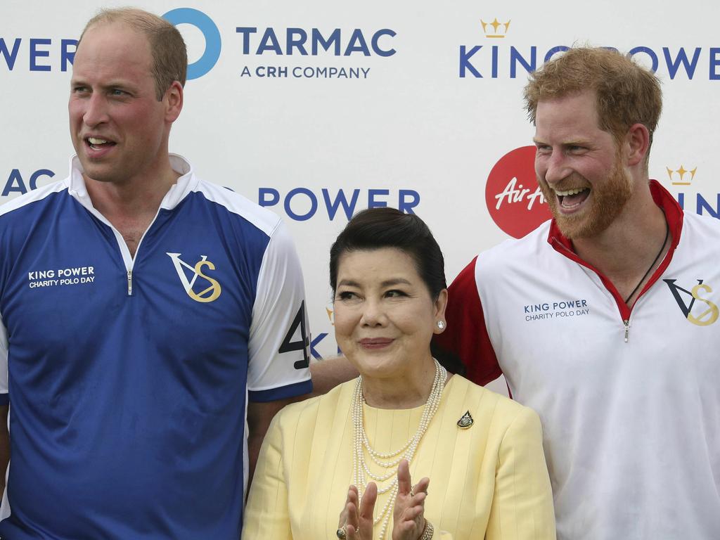 Britain's Prince William and Prince Harry pose with Aimon Srivaddhanaprabha, after they played in the Khun Vichai Srivaddhanaprabha Memorial Polo Trophy. Picture: Andrew Matthews/PA via AP