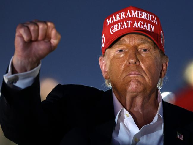 CONCORD, NORTH CAROLINA - MAY 26: Former U.S. President and Republican presidential candidate Donald Trump raises his fist as he looks on during the NASCAR Cup Series Coca-Cola 600 at Charlotte Motor Speedway on May 26, 2024 in Concord, North Carolina. (Photo by Jared C. Tilton/Getty Images) ***BESTPIX***