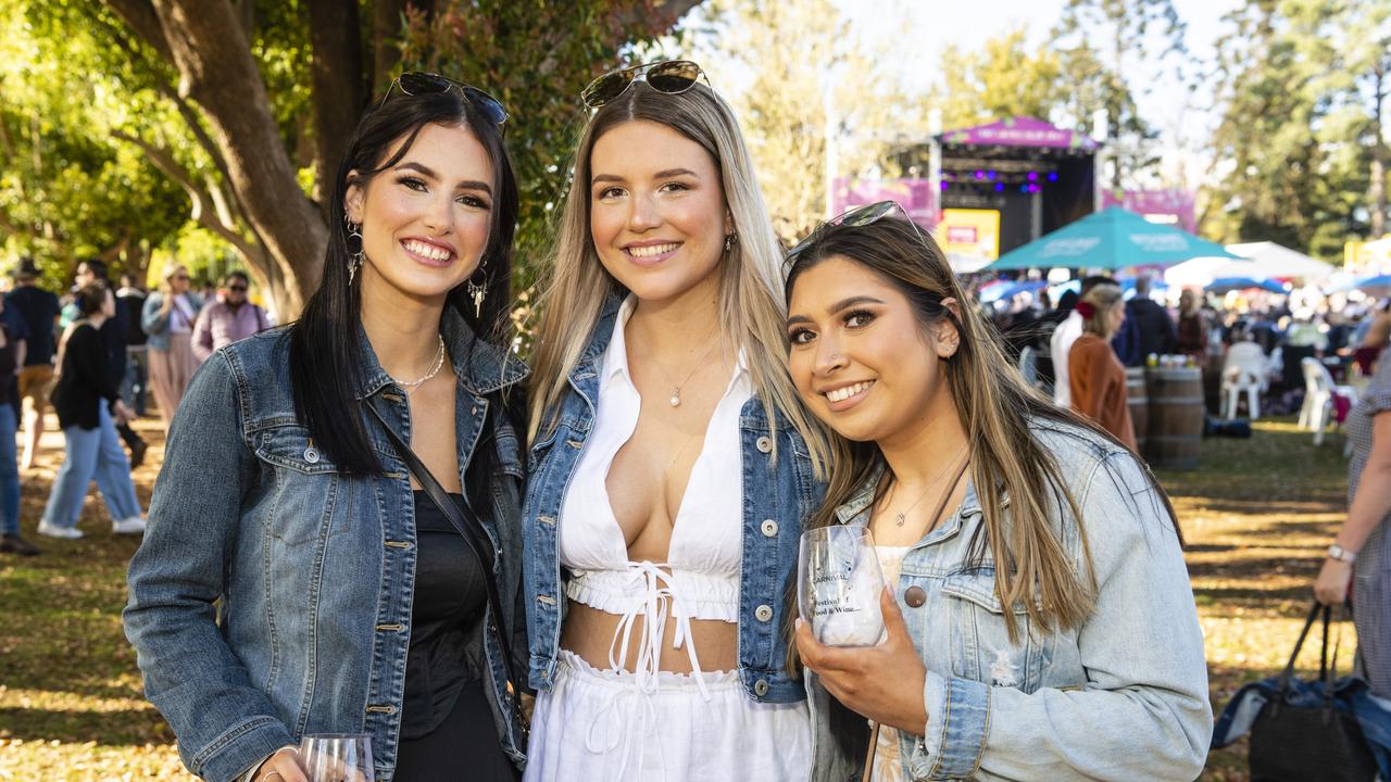 In Queens Park are (from left) Heidi Gibbs, Naomi Tinkler and Faith Argarin of Festival of Food and Wine, Carnival of Flowers 2022, Saturday, September 10, 2022. Picture: Kevin Farmer