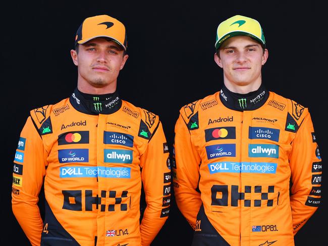 MELBOURNE, AUSTRALIA - MARCH 13: Lando Norris of Great Britain and McLaren and Oscar Piastri of Australia and McLaren looks on during previews ahead of the F1 Grand Prix of Australia at Albert Park Grand Prix Circuit on March 13, 2025 in Melbourne, Australia. (Photo by Clive Rose/Getty Images)