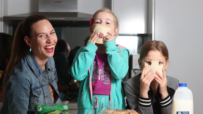 Bree May and her children Winter, 6, and Eden, 9, in the kitchen. Picture: Tait Schmaal.