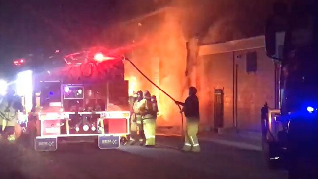 Firefighters battle the blaze at the Tennant Creek IGA on Sunday night.