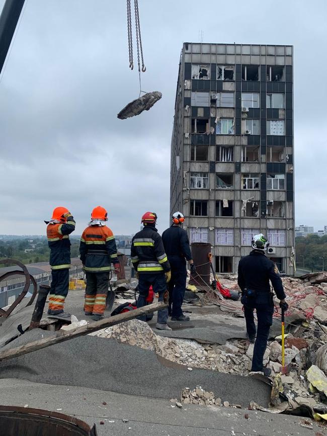 Andy Dunt working on damaged buildings alongside other firefighters in the, city of Kharkiv