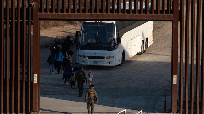 Migrants are processed by Border Patrol San Diego sector agents as seen from Tijuana, Baja California state, Mexico. Picture: AFP.