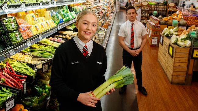 Annabelle Boyd-Turner, in year 12 at St Dominic’s Priory, and Sean Comley, in year 11 at Pembroke, work in the North Adelaide Foodland. Picture Matt Turner.