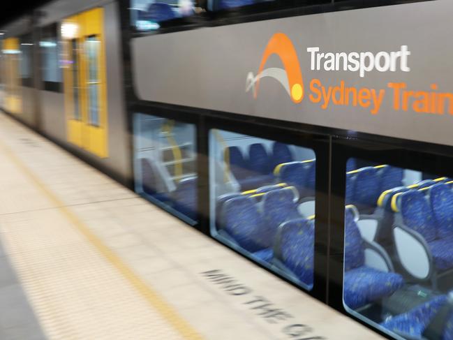 SYDNEY, AUSTRALIA - MAY 19:  Signage is seen on a Transport Sydney train as it pulls into to a platform on May 19, 2020 in Sydney, Australia. Strict social distancing measures have been introduced for public transport as Sydneysiders begin to travel around the city again as COVID-19 restrictions ease in Australia. Capacity on buses, trains, ferries and light rail will be significantly reduced with only 12 people will be allowed on a bus and 32 in a train carriage as the NSW government works to maintain strict physical distancing of 1.5 metres on the network. Green stickers on seats will indicate where commuters can sit at a safe distance. Temporary car parking zones and cycle ways across Sydney's inner city will also be set up to encourage commuters to bike or drive to work.  (Photo by Mark Kolbe/Getty Images)