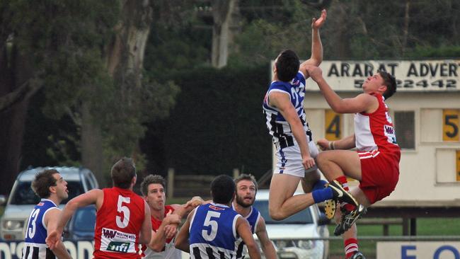 Minyip-Murtoa's Kieran Delahunty, left, and Ararat opponent Zac Louder battle in the ruck during a 2014 match. Picture: Aaron Cook