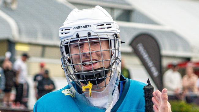 Tassie goalkeeper Magnus McCausland is congratulated after his penalty shootout heroics. Picture: Liam Boric/Liberty Hockey One League