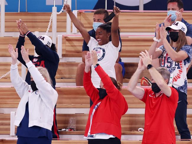 Simone Biles of Team United States cheers with teammates Jordan Chiles (L) and Grace McCallum (R) from the stands during the Women's Vault Final. Picture: Getty Images