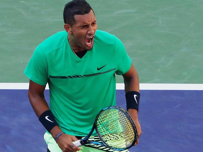 Nick Kyrgios celebrates match point against Novak Djokovic in their fourth round match of the 2017 BNP Paribas Open at Indian Wells.