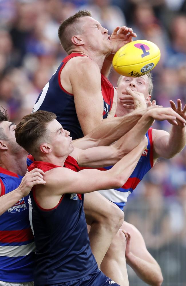 Melbourne stars Tom McDonald and Bayley Fritsch battle Easton Wood and Alex Keath for the ball. Picture: Dylan Burns/AFL Photos via Getty Images