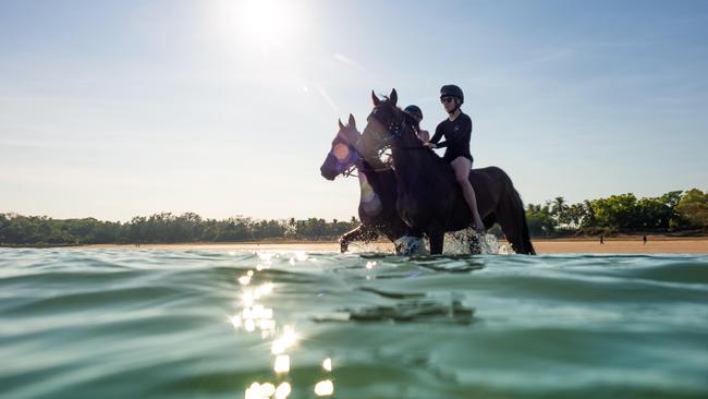 Gary Lefoe's stable is preparing for the upcoming Metric Mile as part of the Darwin Cup Carnival. Jockey Casey Hunter rides Budget King whilst Jason Lyon rides Casino Seventeen at Mindil Beach. Picture: Che Chorley