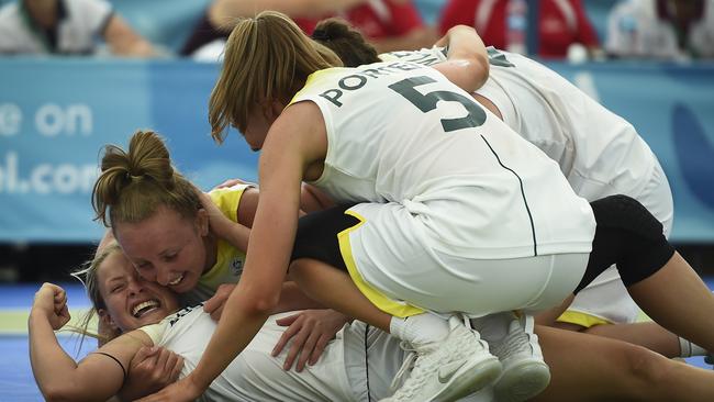 Ruby Porter (front) celebrates with teammates after winning the 3x3 Basketball bronze medal at the Youth Olympic Games in Buenos Aires, Argentina. Picture: Marcelo Endelli/Getty Images