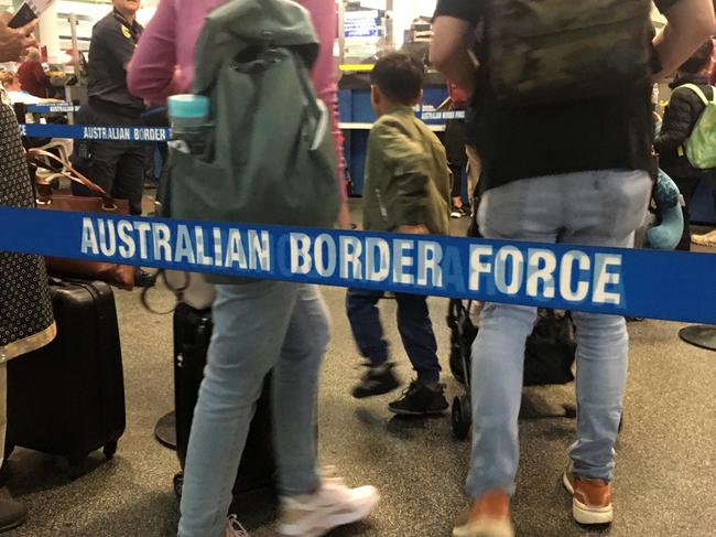 Brisbane - Dec 02 2022:Passengers walking through Australian border force lines. The federal law enforcement agency responsible for border control enforcement, compliance and detention in Australia.