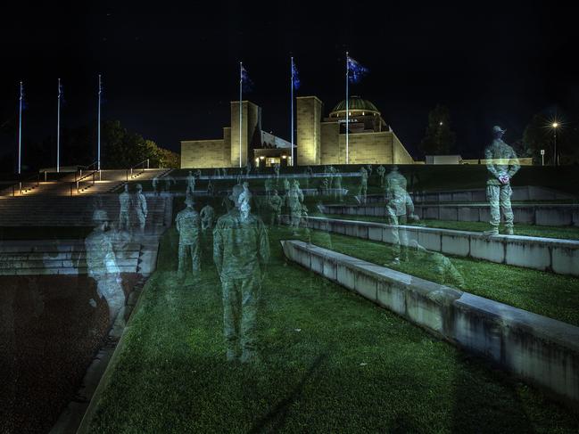 Ghostly figures of Australian soldiers at the Australian War Memorial in a single photographic exposure to honour the 41 Diggers killed in Afghanistan and in tribute to the 1927 painting ‘Menin Gate at Midnight’ by artist Will Longstaff. Picture: Gary Ramage