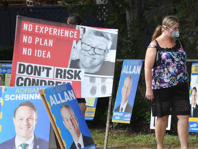 Voters are seen at the Virginia pre-polling booth for the Brisbane City Council elections in Brisbane, Friday, March 27, 2020. Queensland's local government elections are due to be held on Saturday despite the threat of the Coronavirus (COVID-19). (AAP Image/Darren England) NO ARCHIVING