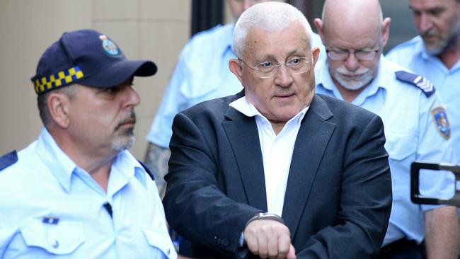 Ron Medich is escorted into a prison van after his conviction on Monday. Picture: Jeremy Piper