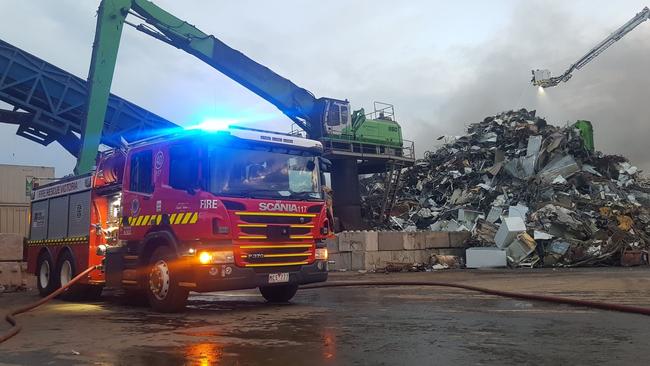 Firefighters tackling the pile of burning waste. Picture: Uniform Photography