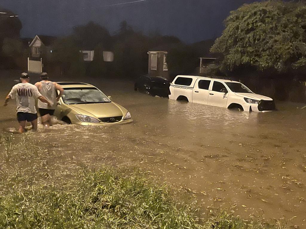 Cars and people underwater is Ballarat Rd, North Geelong, near the McKellar Centre. Picture: Wayne Buttner