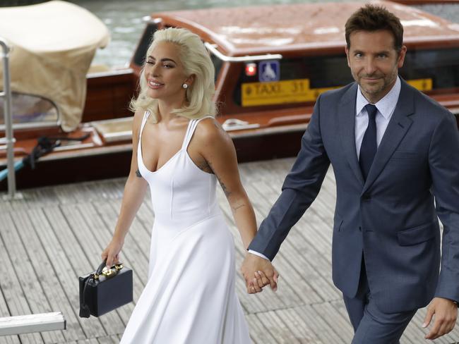 Lady Gaga and Bradley Cooper arrive for a photo call at the Venice Film Festival. Picture: AP / Kirsty Wigglesworth