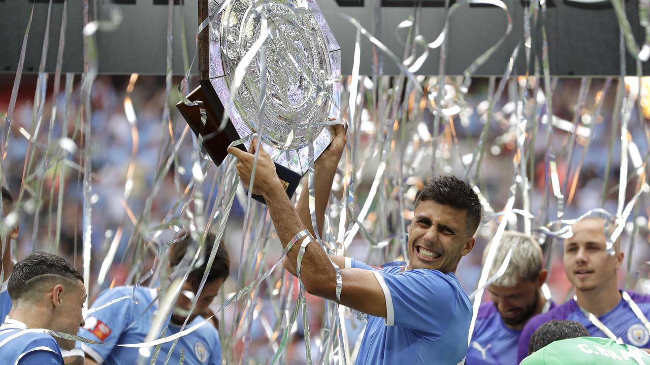 Manchester City's Rodri holds up the Community Shield trophy. (AP Photo/Kirsty Wigglesworth)