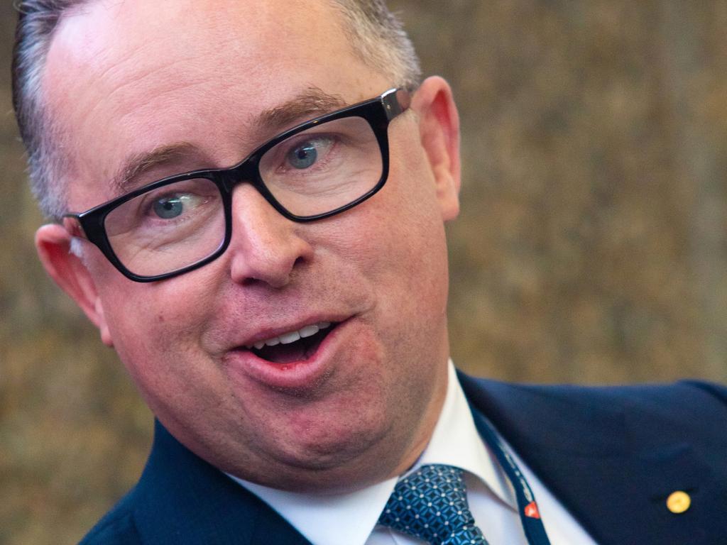 Alan Joyce – wearing the distinctive glasses cartoonist Mark Knight included in the cartoon – is laughing all the way to the bank. Picture: Peter Boer/Bloomberg via Getty Images