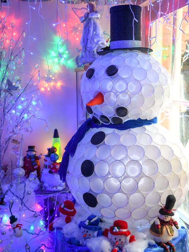 She opens her decorations, complete with snowman, to the public for free. Picture: Penny Stephens