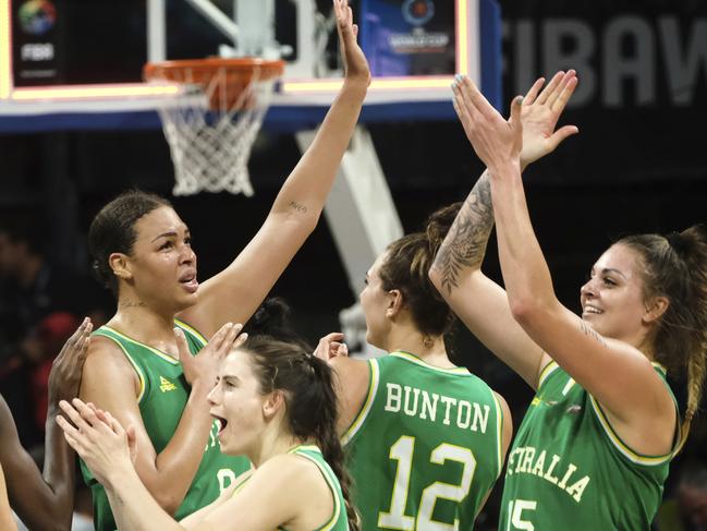 The Australian team celebrate their victory over Spain, in the Women's basketball World Cup semi final. Picture: AP Photo