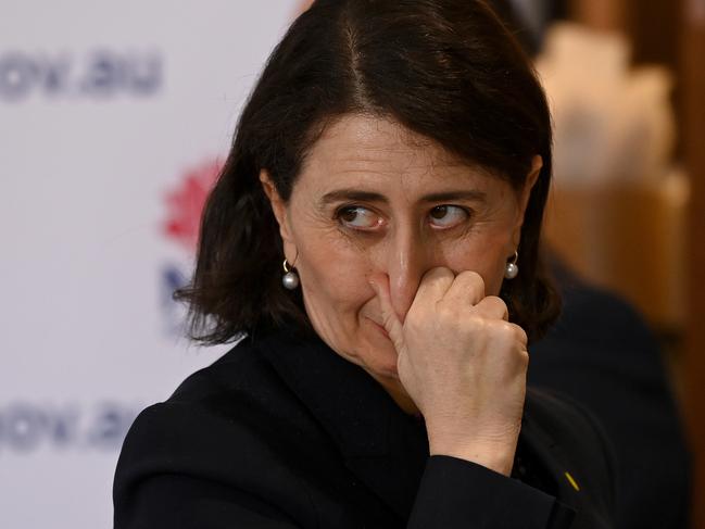 SYDNEY, AUSTRALIA - SEPTEMBER 09: NSW Premier Gladys Berejiklian touches her face during a COVID-19 press conference on September 9, 2021 in Sydney, Australia. NSW recorded 1,405 new locally acquired cases of COVID-19 and five deaths in the past 24 hours. Parts of regional NSW currently deemed low risk and which have seen zero COVID cases for at least 14 days will emerge from lockdown at 12:01am Saturday September 11. (Photo by Bianca De Marchi - Pool/Getty Images)