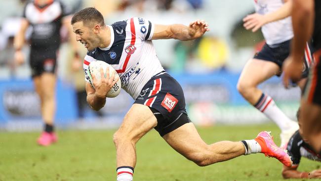 SYDNEY, AUSTRALIA - MARCH 21: James Tedesco of the Roosters breaks away to score a try during the round two NRL match between the Wests Tigers and the Sydney Roosters at Campbelltown Sports Stadium, on March 21, 2021, in Sydney, Australia. (Photo by Mark Kolbe/Getty Images)