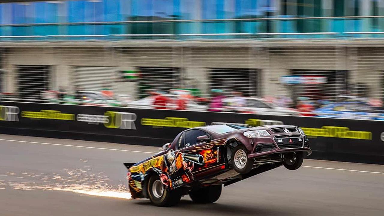 Driver Nigel Benson gets his ute the 'Aussie Bandit' on two wheels Picture: Facebook