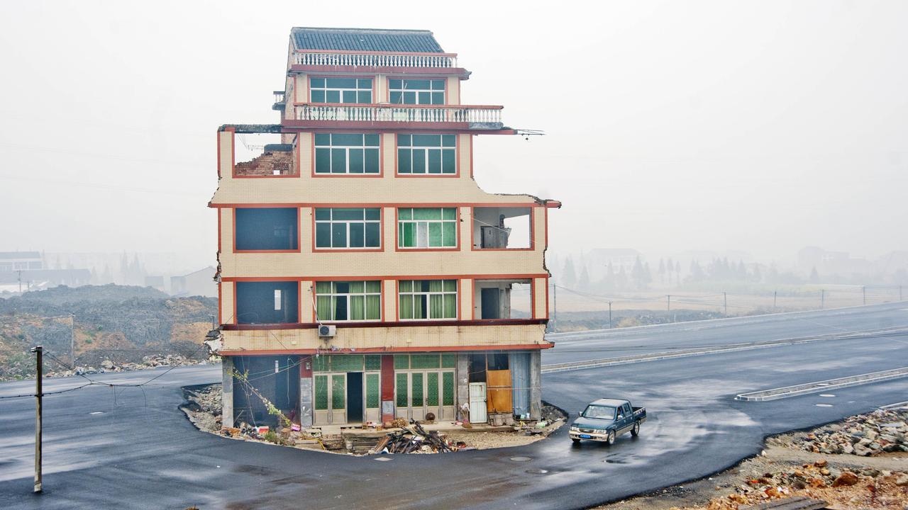 An isolated house in the middle of a new highway in Wenling city.