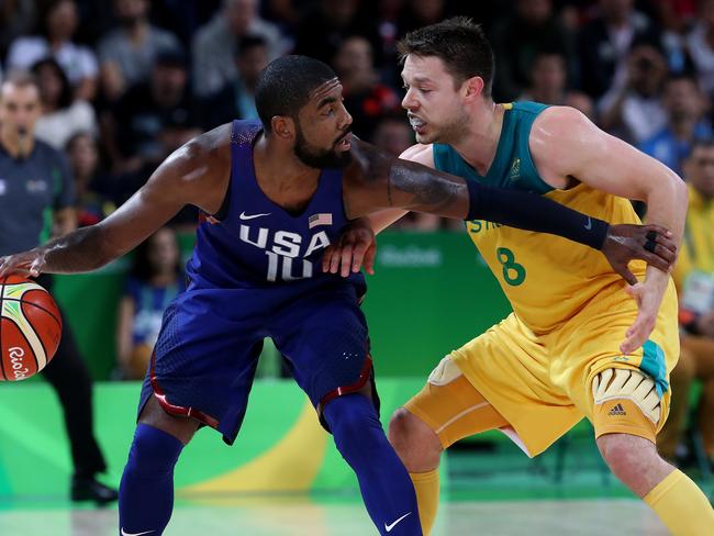 Team USA’s Kyrie Irving and Australia’s Matthew Dellavedova in action. Picture: Adam Head