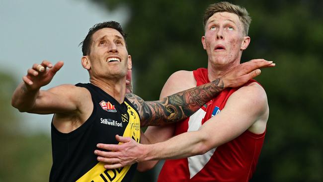 Glenelg's Jesse White, left, a former AFL player at Sydney and Collingwood, illustrated Eddie Betts’ new book. Picture: Tom Huntley