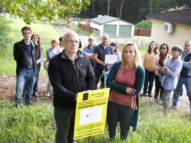 Carli Jeffrey and with John Farrar from (FRAG) with Residents who are furious after a development application was lodged by the San Hospital's parent company for high-rise development wrapping around the Sydney Adventist School on Fox Valley Rd, Wahroonga. Wednesday 2nd May 2017 ( AAP image/ Mark Scott )